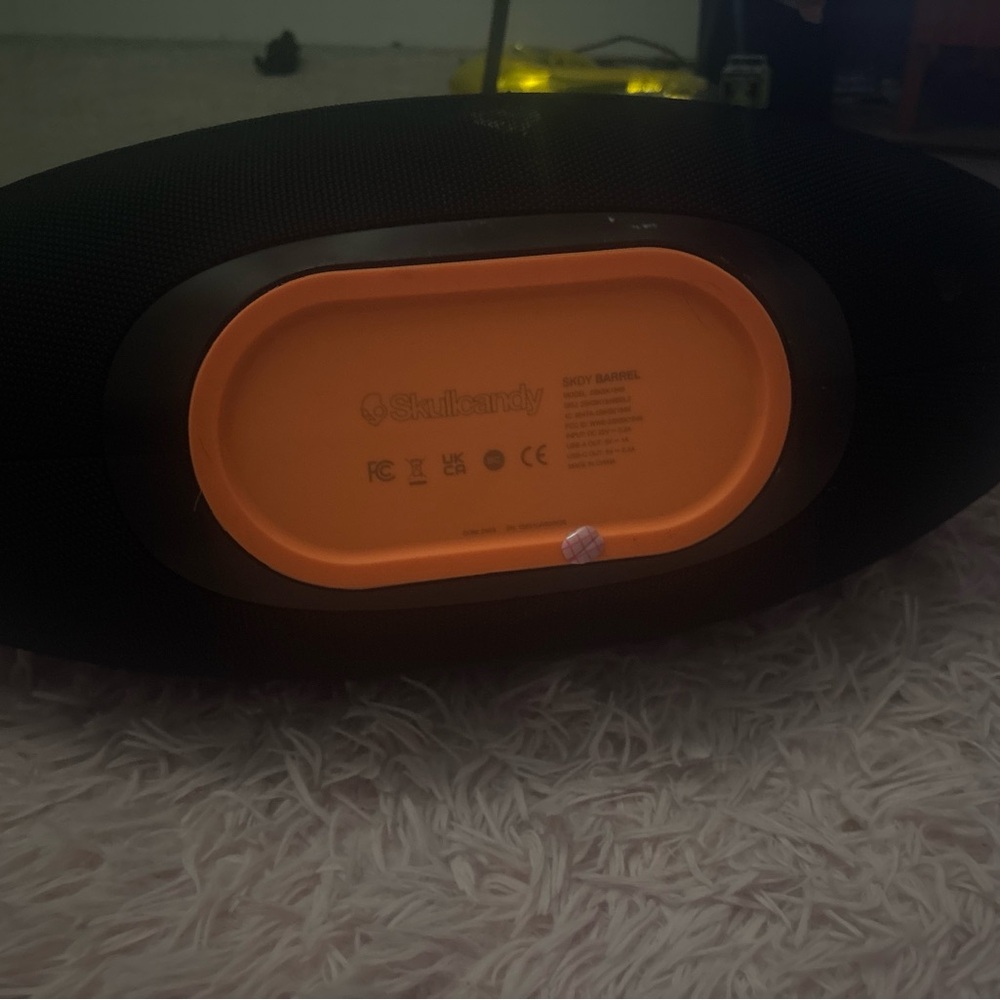 Skullcandy Black and Orange Audio Device